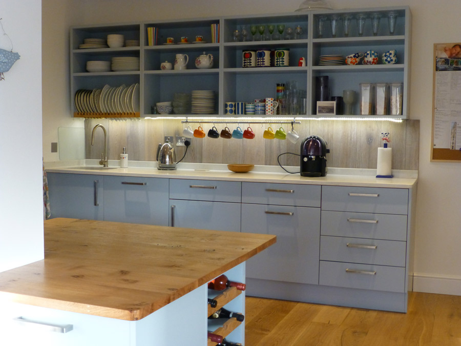 bespoke kitchen in blue-gray with white quartz worktop