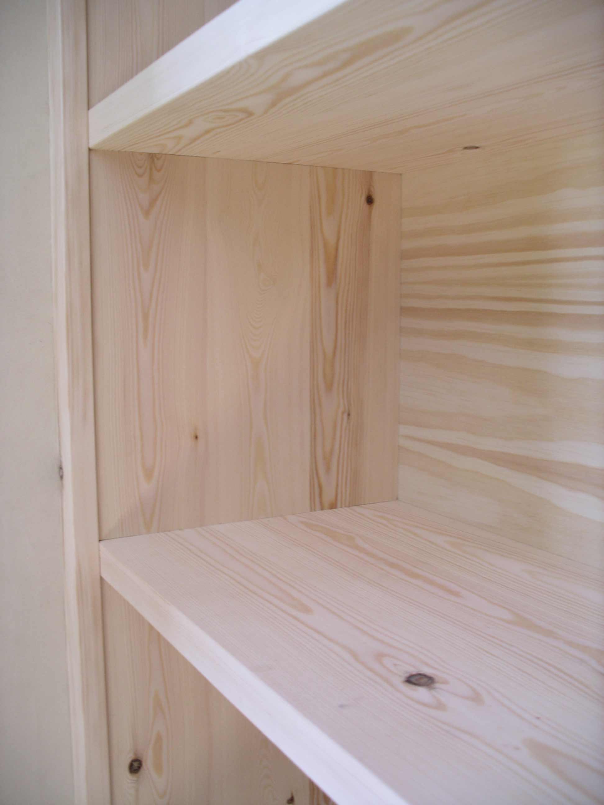 shelf housed into groove in the bookcase side
