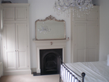 custom built vintage style alcove wardrobes in Farrow & Ball Shaded White