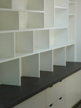 fitted study bookcase with random shelving and storage cabinets