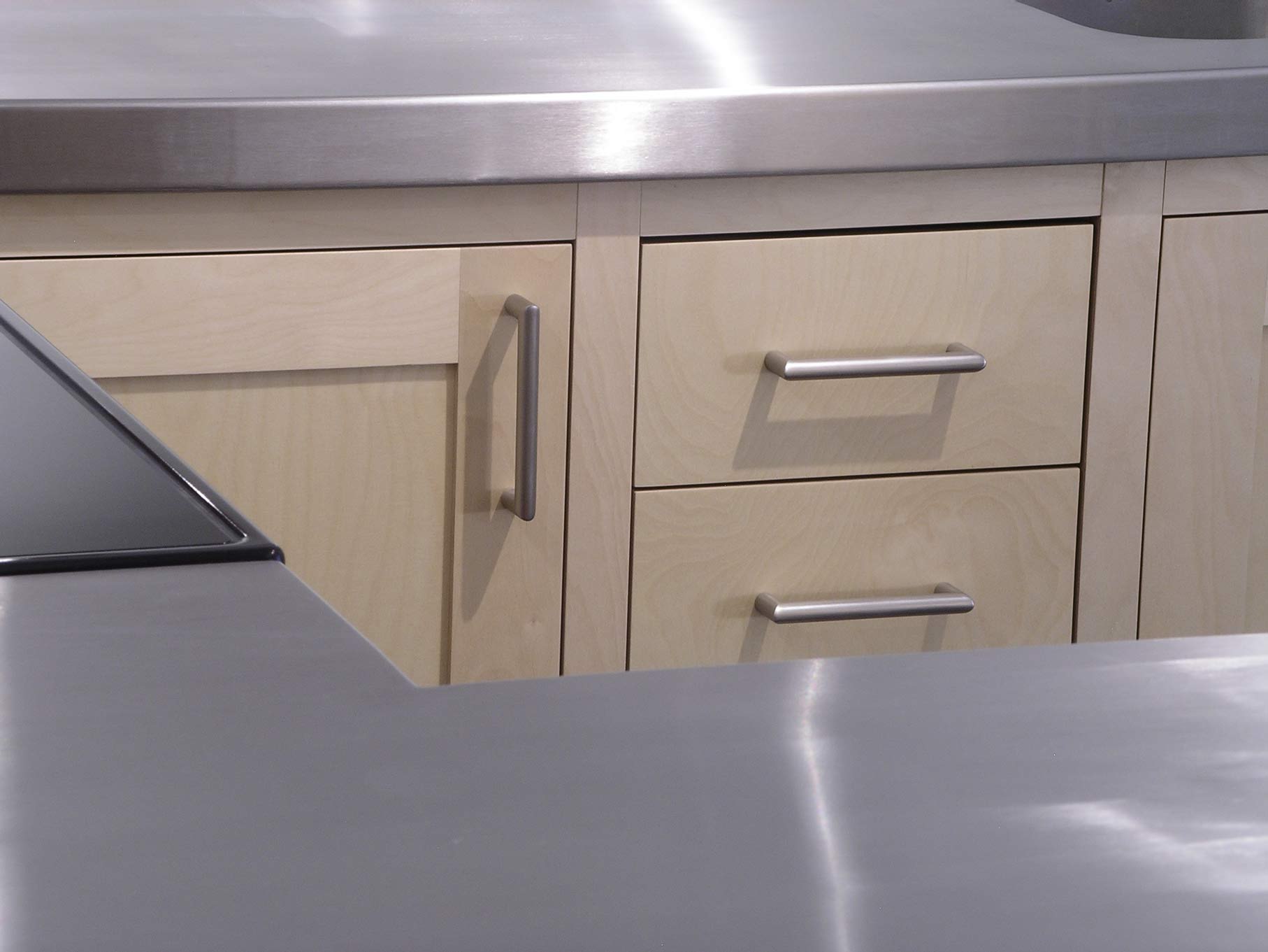 stainless steel worktop and kitchen drawers fitted kitchen by Peter Henderson Furniture