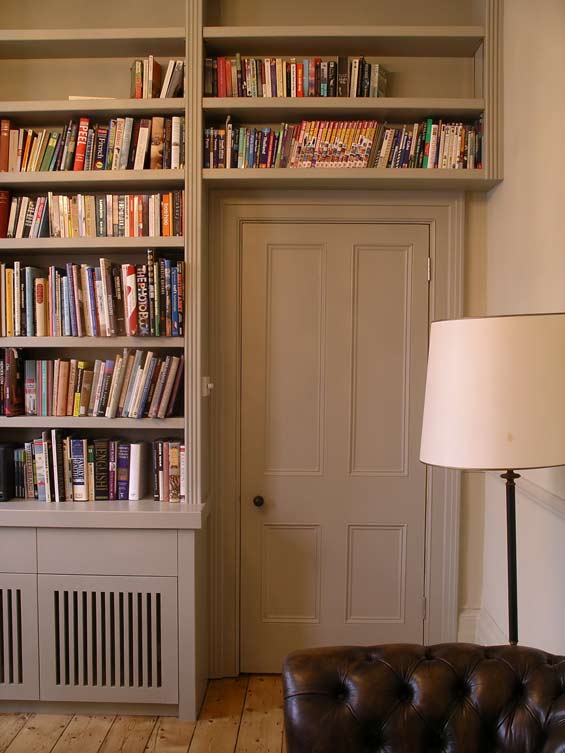 fitted bookcase extends over the door