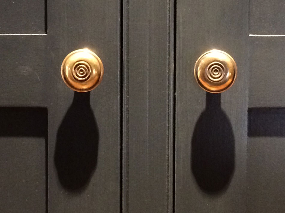 brass knobs on bespoke wardrobe