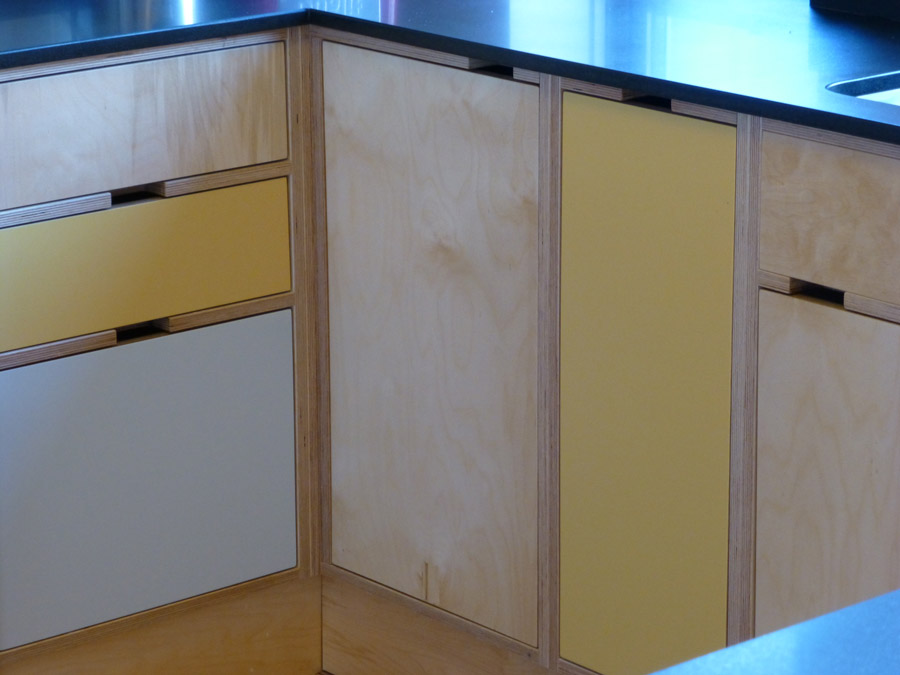 cut-out handles in birch plywood cabinets