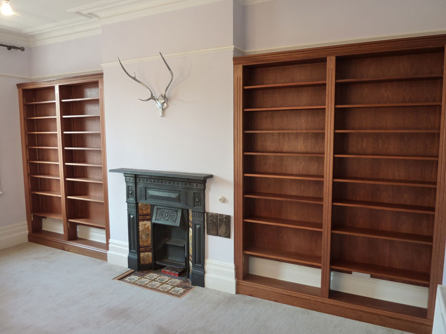 bespoke fitted mahogany and sapele bookcases