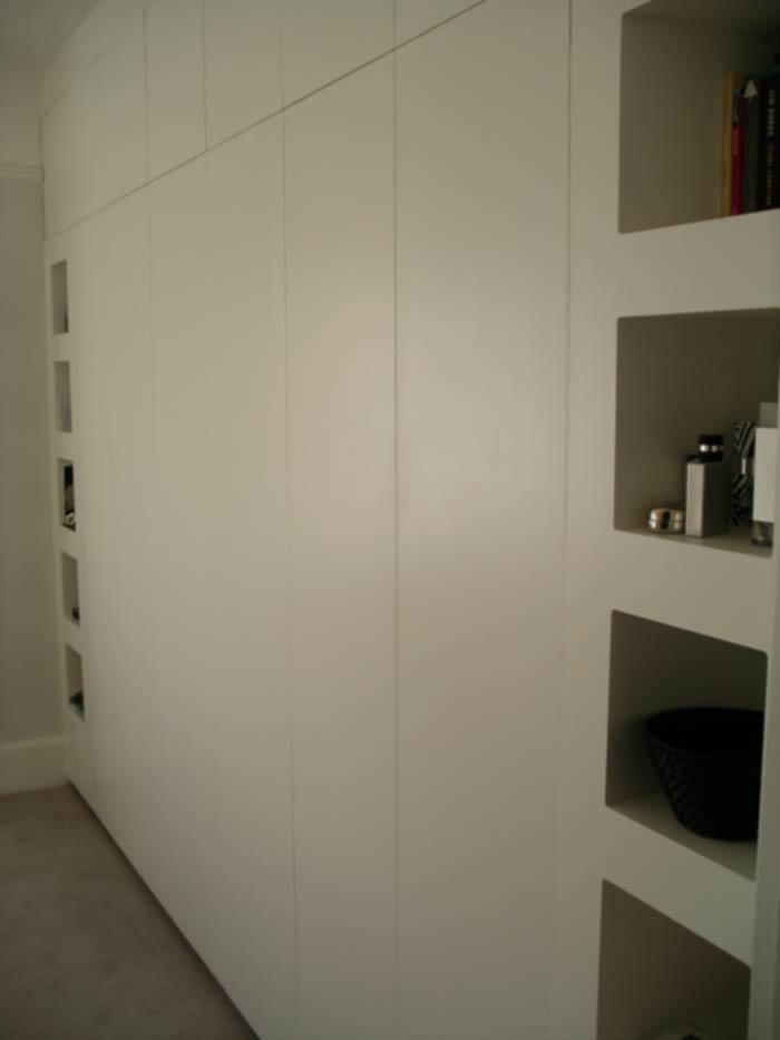 contemporary fitted wardrobe with push-click doors